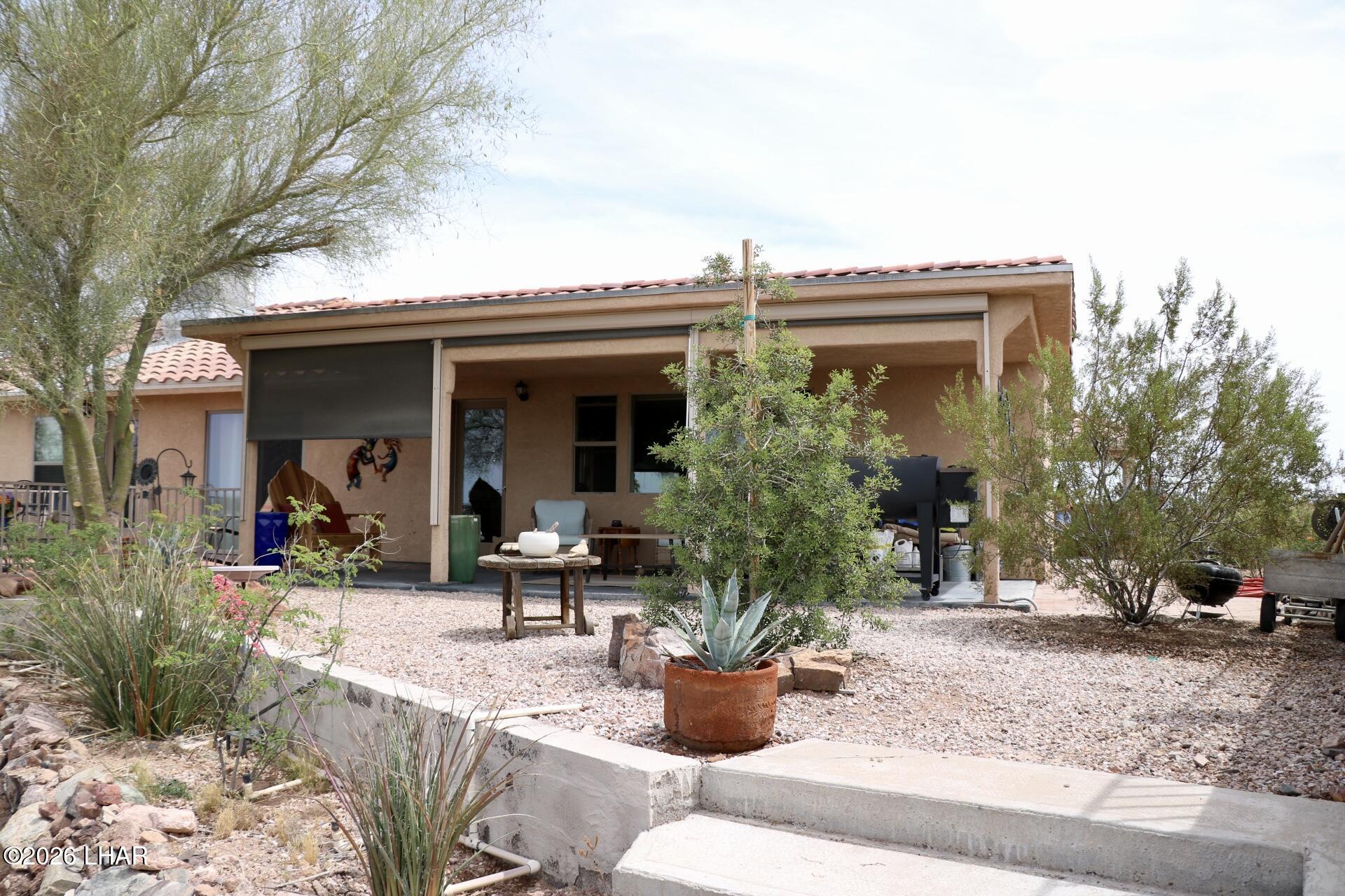 42832 La Posa Road Bouse, AZ 85325 - Photo 44 of 62 a view of house with patio outdoor seating