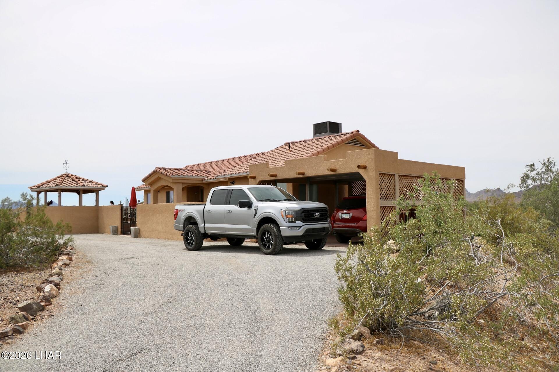 42832 La Posa Road Bouse, AZ 85325 - Photo 48 of 62 a car parked in front of a house
