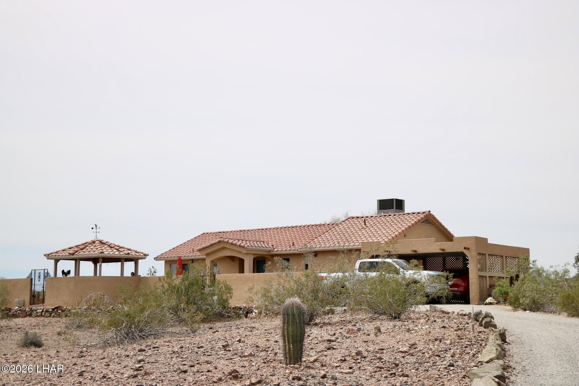 42832 La Posa Road Bouse, AZ 85325 - Photo 55 of 62 a front view of a house with a yard