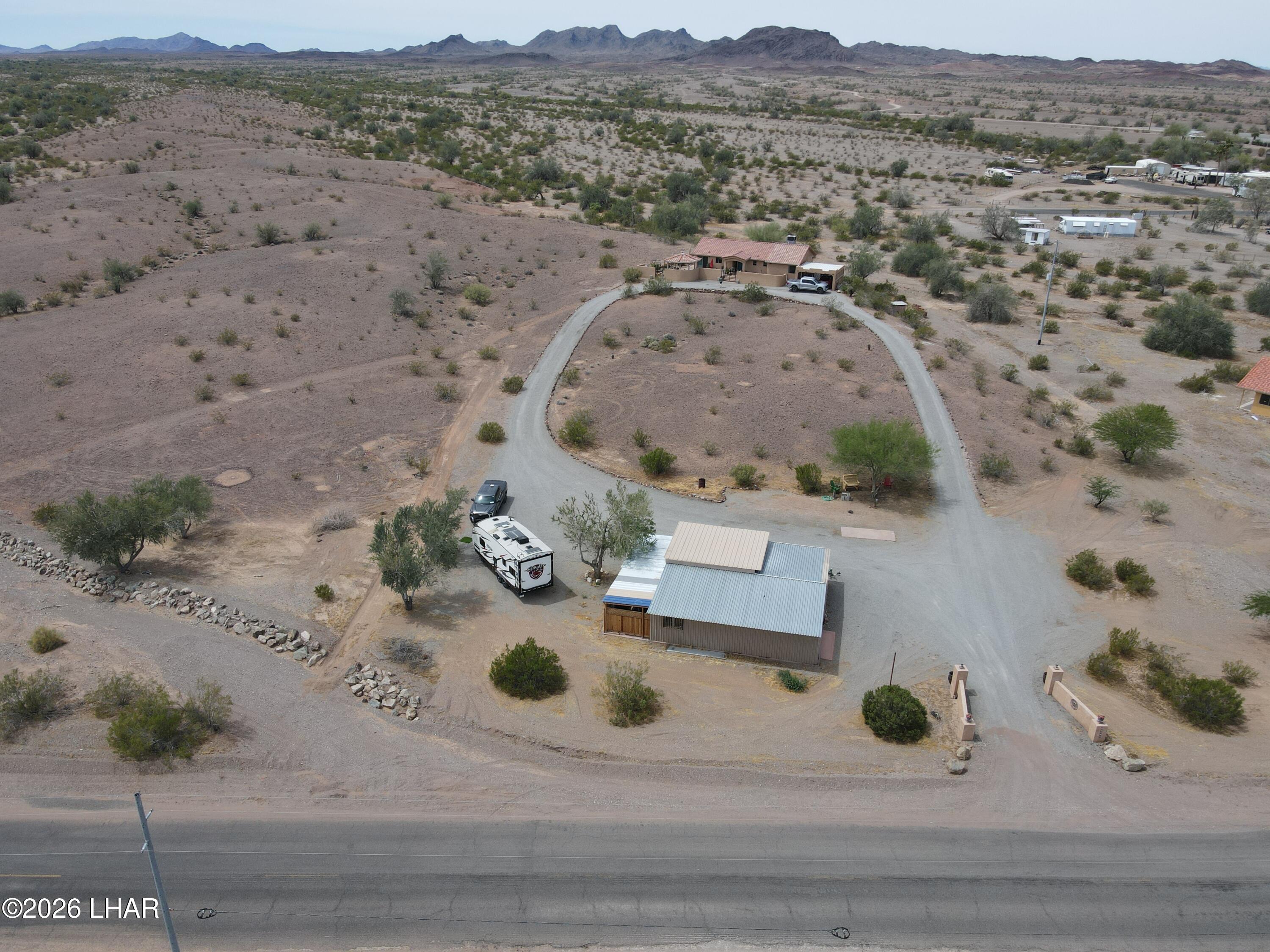 42832 La Posa Road Bouse, AZ 85325 - Photo 6 of 62 an aerial view of a house with outdoor space