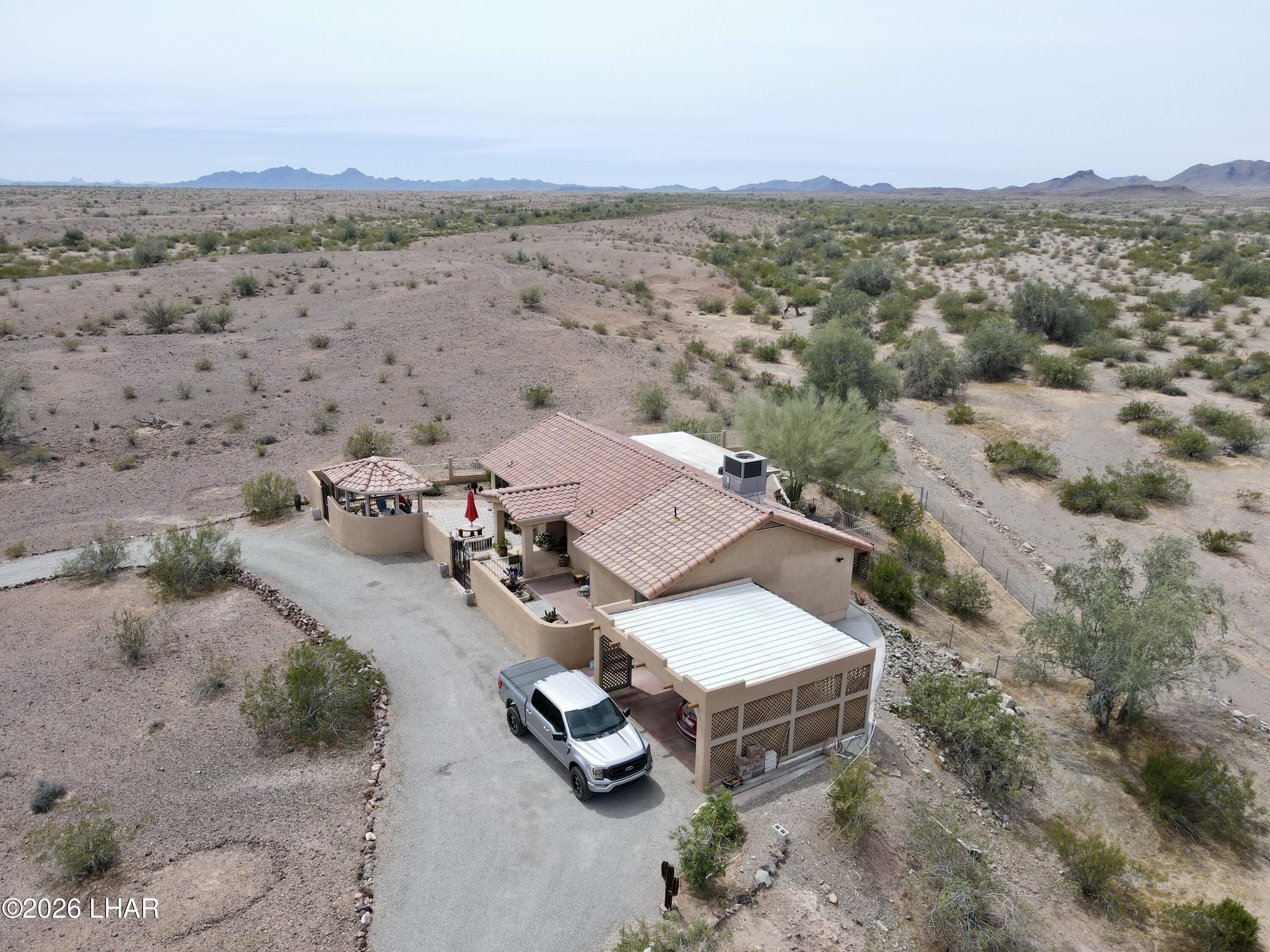 42832 La Posa Road Bouse, AZ 85325 - Photo 62 of 62 an aerial view of a house with a mountain