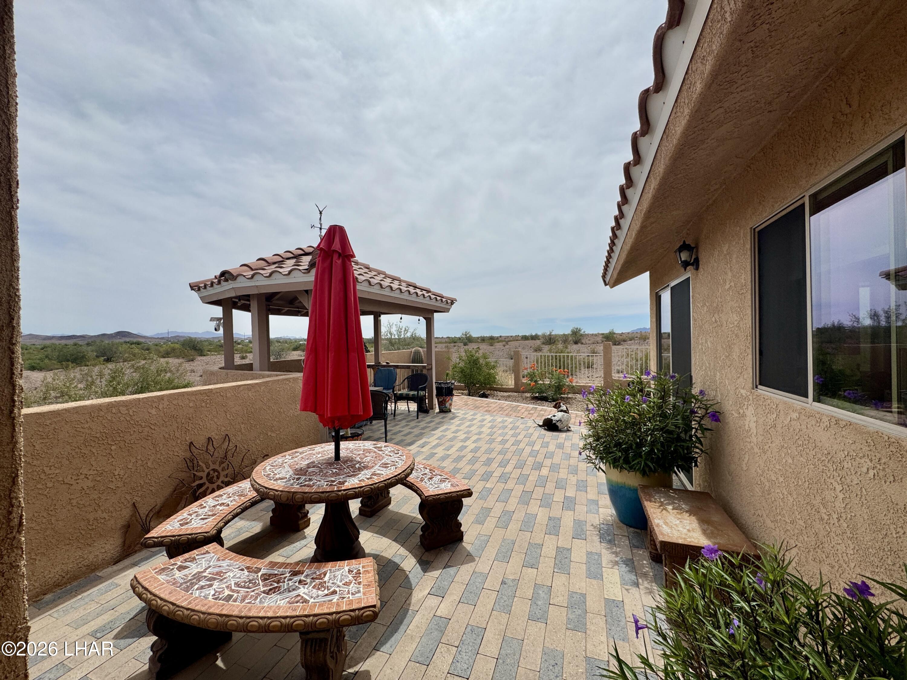 42832 La Posa Road Bouse, AZ 85325 - Photo 7 of 62 a view of a balcony with furniture and a potted plants