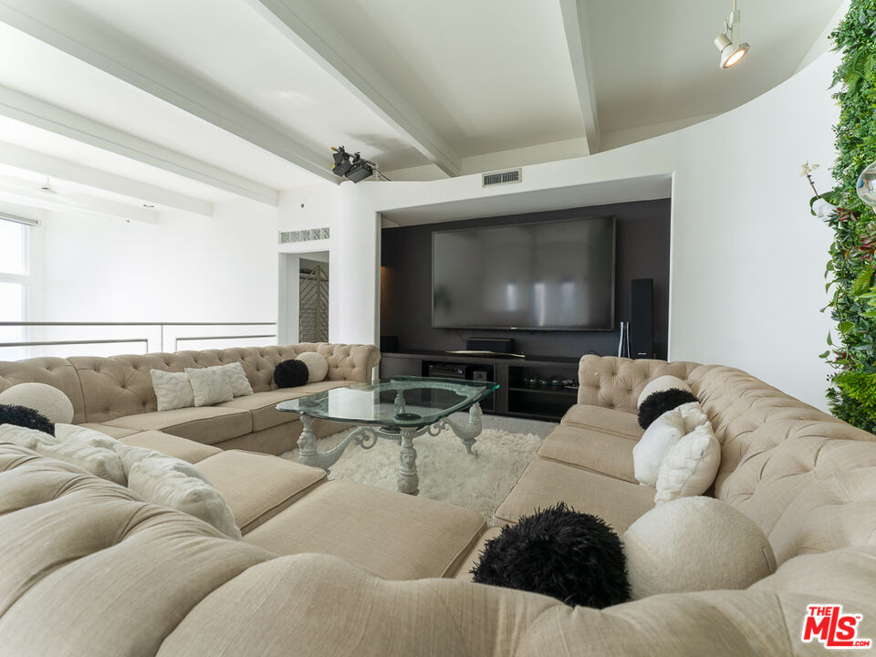 31518 Anacapa View Drive Malibu, CA 90265 - Photo 18 of 75 a living room with furniture and a flat screen tv
