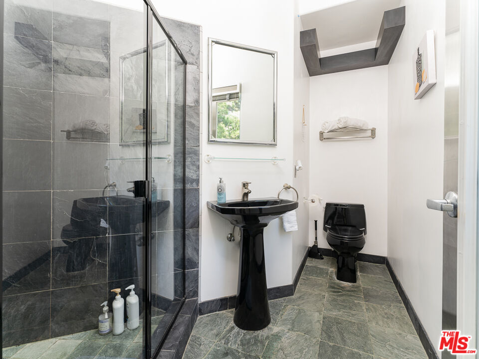 31518 Anacapa View Drive Malibu, CA 90265 - Photo 25 of 75 a bathroom with a sink and toilet