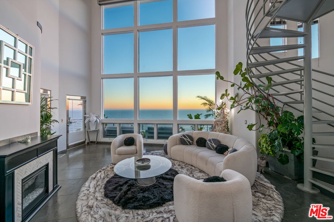 31518 Anacapa View Drive Malibu, CA 90265 - Photo 4 of 75 a living room with furniture and a floor to ceiling window