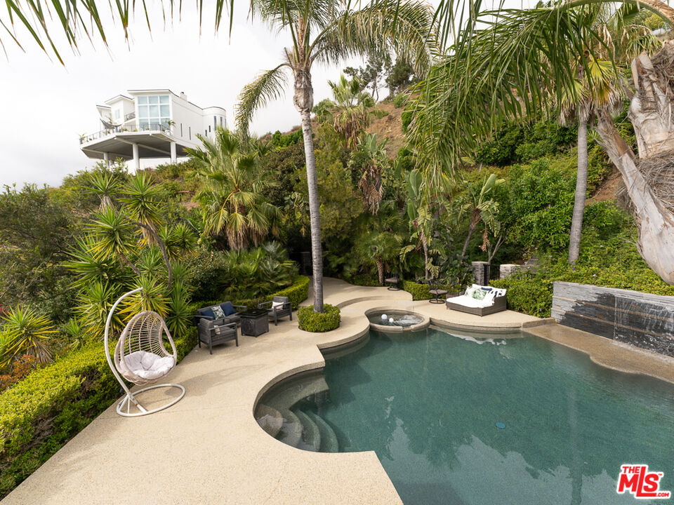 31518 Anacapa View Drive Malibu, CA 90265 - Photo 50 of 75 a view of backyard with swimming pool and outdoor seating
