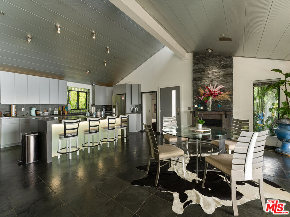 31518 Anacapa View Drive Malibu, CA 90265 - Photo 62 of 75 a living room with lots of furniture and kitchen view