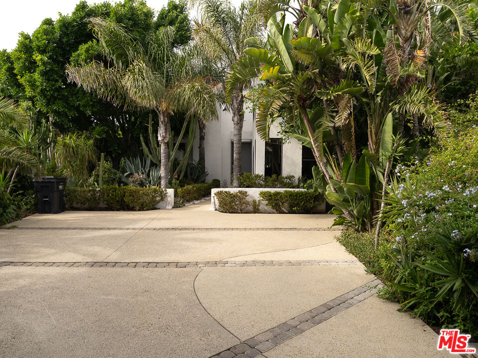 31518 Anacapa View Drive Malibu, CA 90265 - Photo 70 of 75 a front view of a house with yard and trees