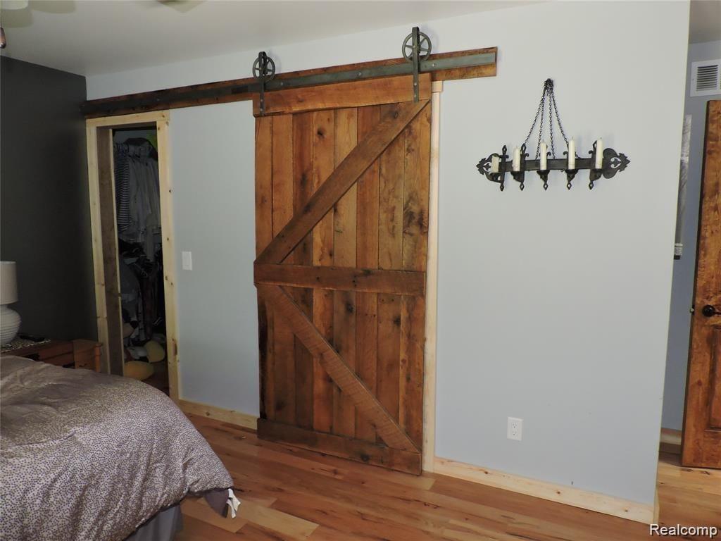 5265 Hickory Ridge Road Holly, MI 48442 - Photo 17 of 43 Barn Door to Master Bath