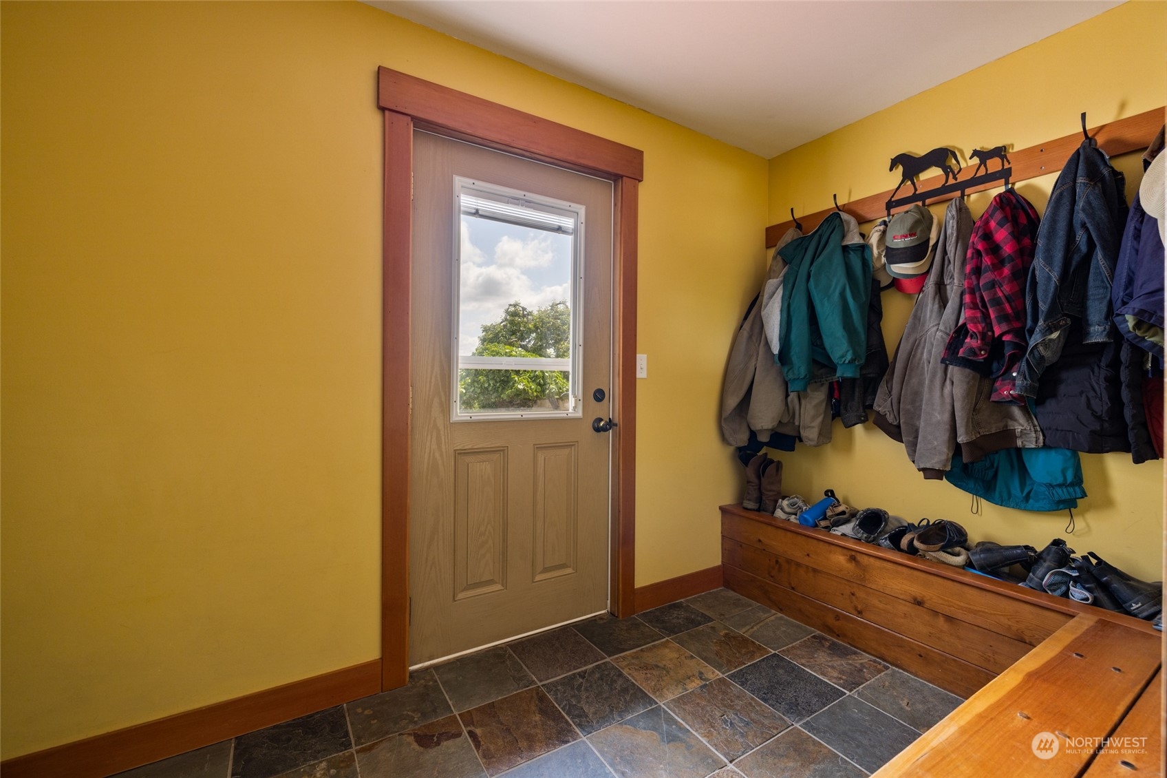 16244 Field Road Bow, WA 98232 - Photo 27 of 40 a view of walk in closet with clothes and shoes