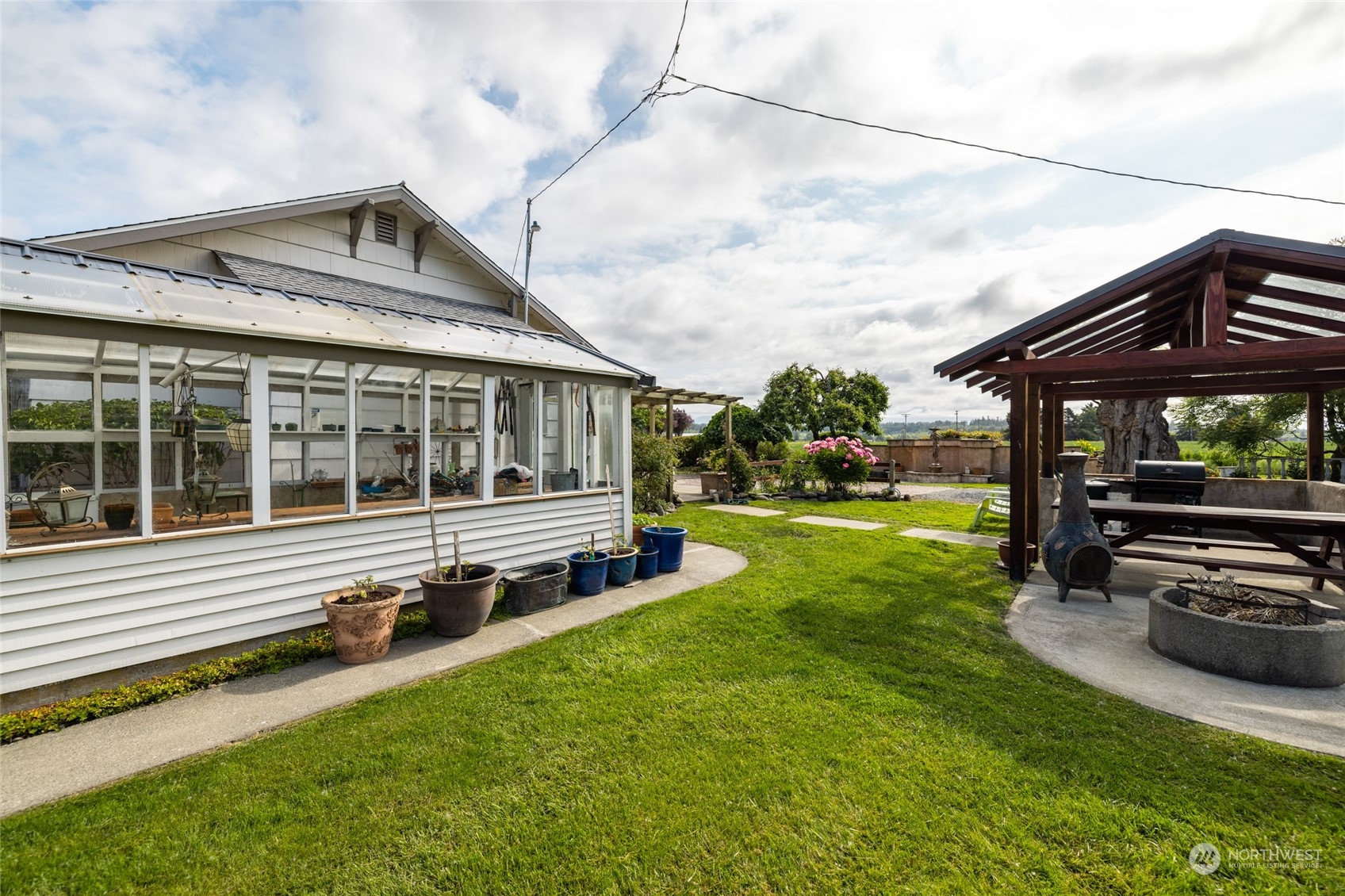 16244 Field Road Bow, WA 98232 - Photo 30 of 40 a view of a house with a large window and yard