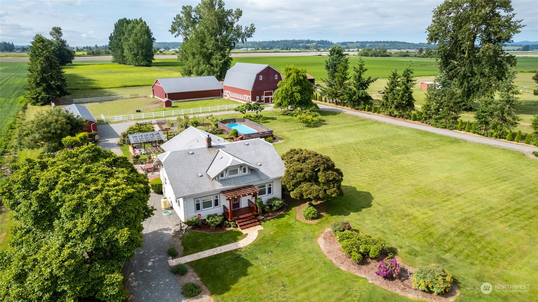 16244 Field Road Bow, WA 98232 - Photo 40 of 40 an aerial view of a swimming pool with a yard and plants