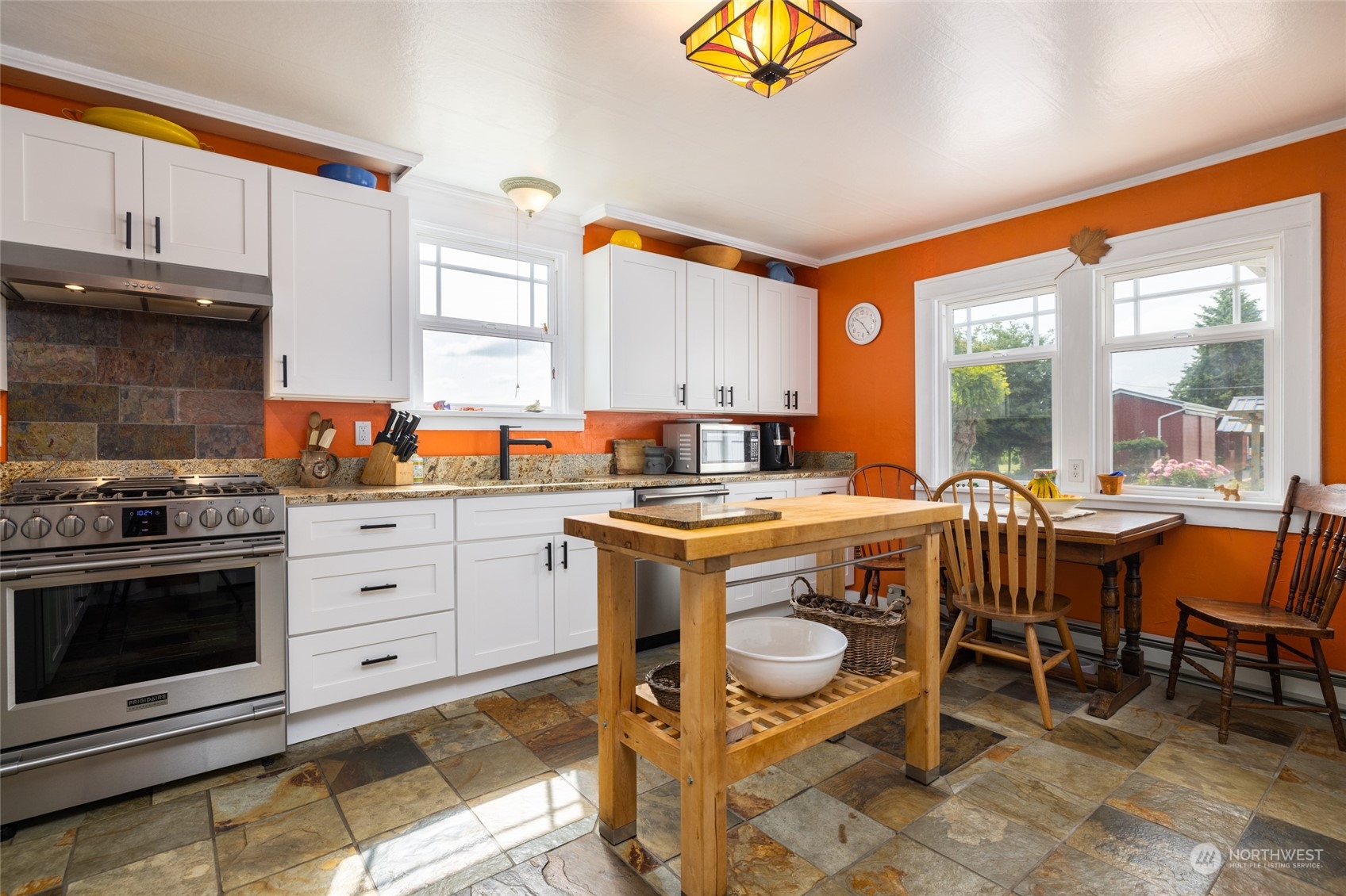 16244 Field Road Bow, WA 98232 - Photo 10 of 40 a kitchen with a stove a table and chairs in it