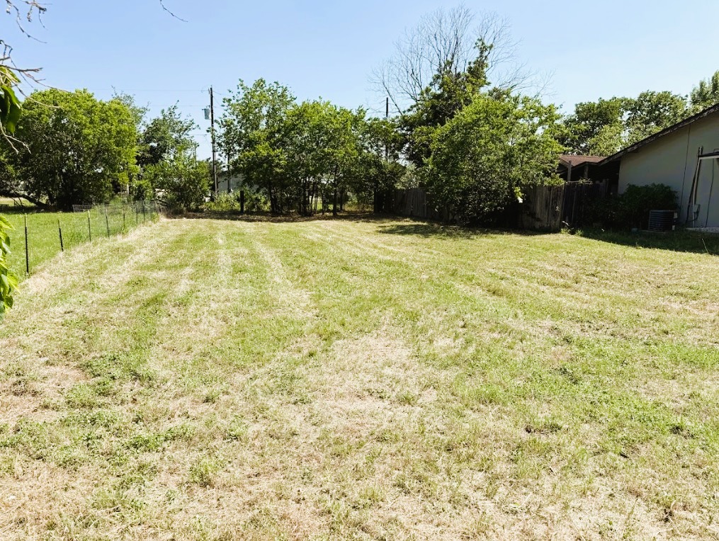 104 Burton Street Manor, TX 78653 - Photo 2 of 11 a view of swimming pool with an outdoor space
