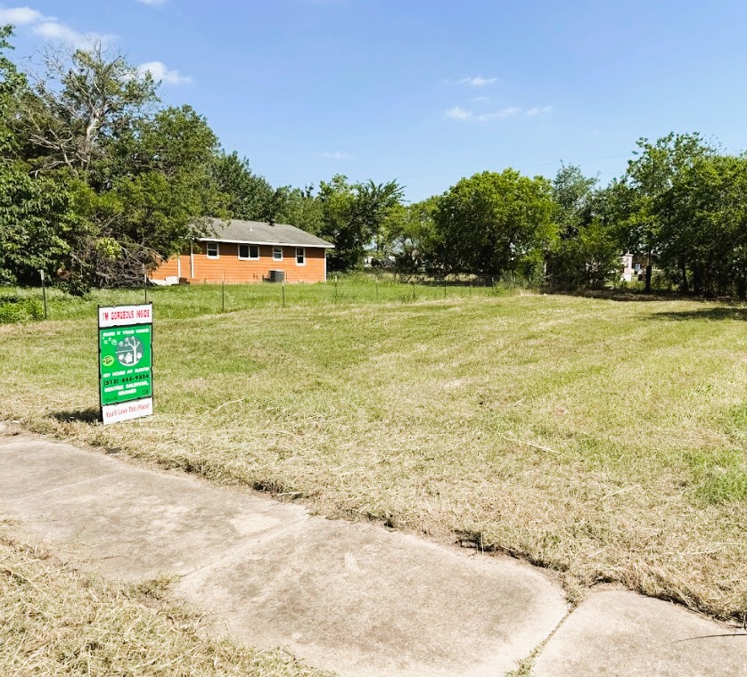 104 Burton Street Manor, TX 78653 - Photo 10 of 11 a view of a swimming pool with an outdoor space and seating area