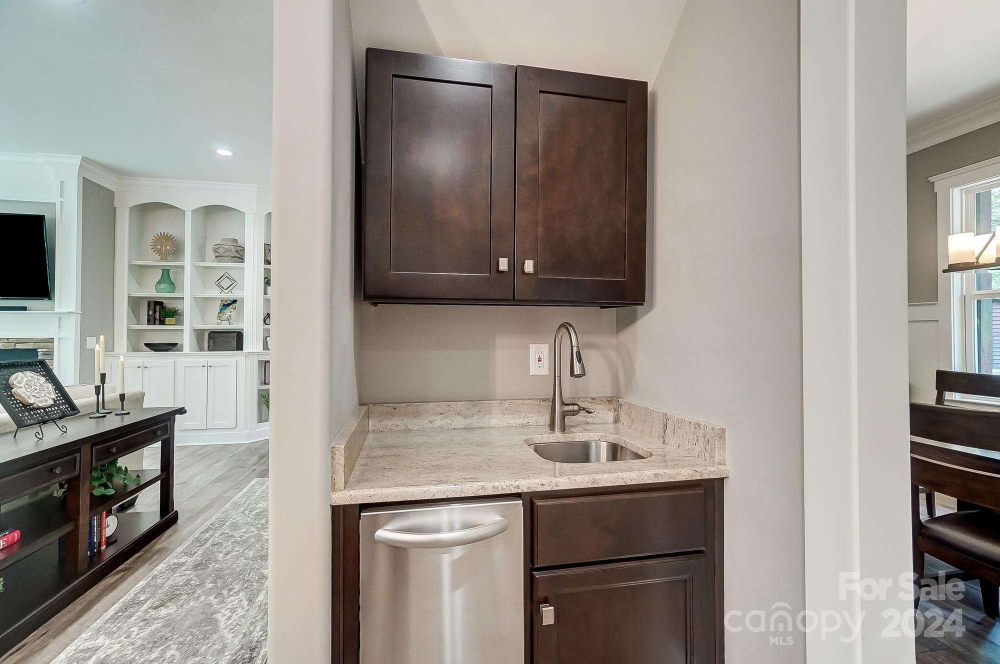 1123 Blacksnake Road Stanley, NC 28164 - Photo 15 of 48 a kitchen with a sink and a microwave