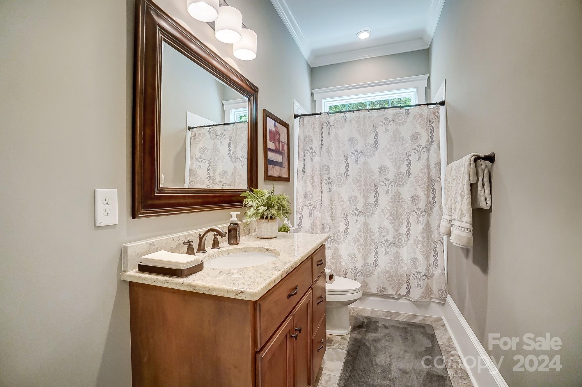 1123 Blacksnake Road Stanley, NC 28164 - Photo 20 of 48 a bathroom with a sink and a mirror