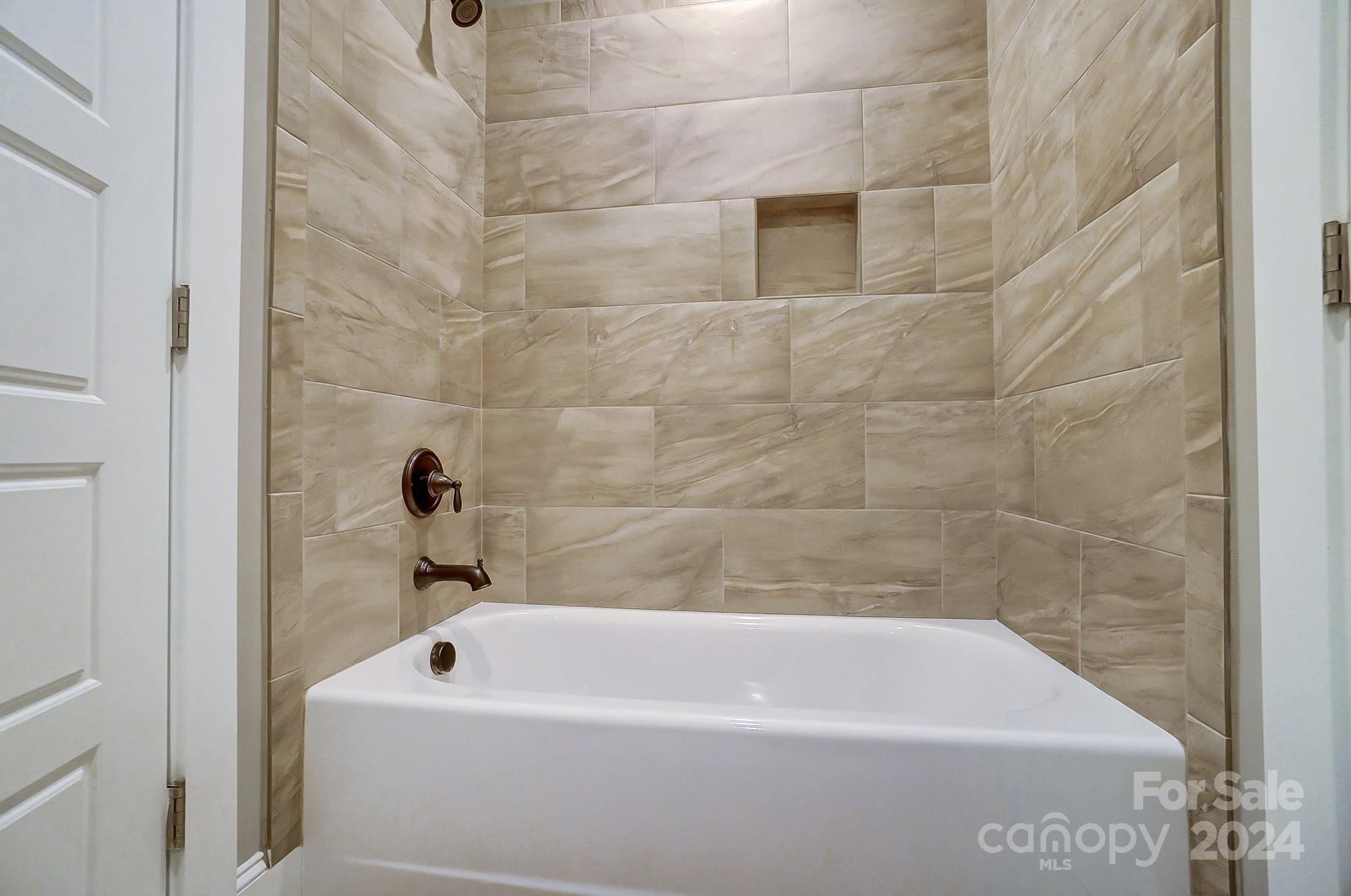1123 Blacksnake Road Stanley, NC 28164 - Photo 35 of 48 a bathroom with a bathtub