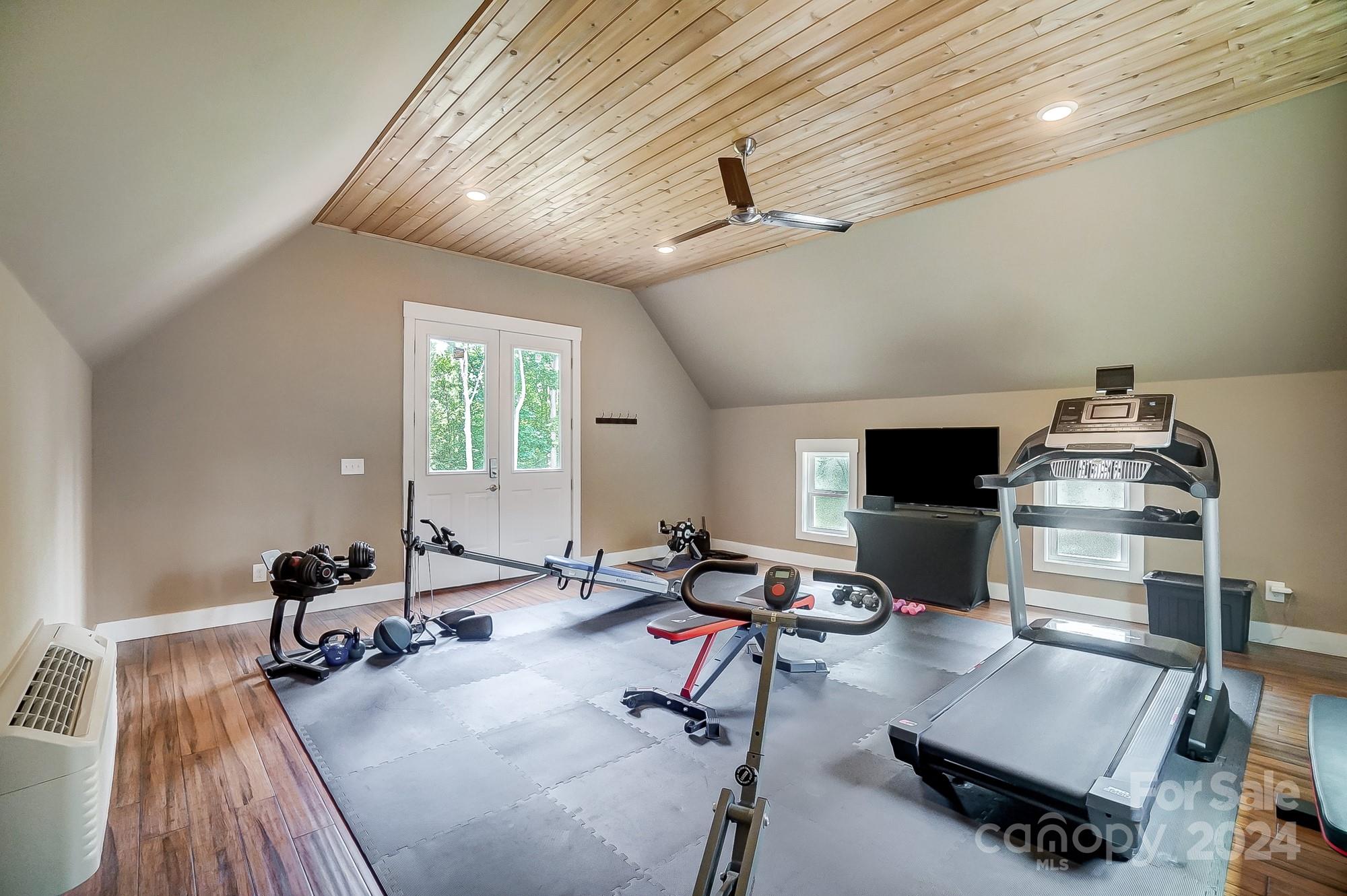 1123 Blacksnake Road Stanley, NC 28164 - Photo 40 of 48 a living room with furniture and a wooden floor
