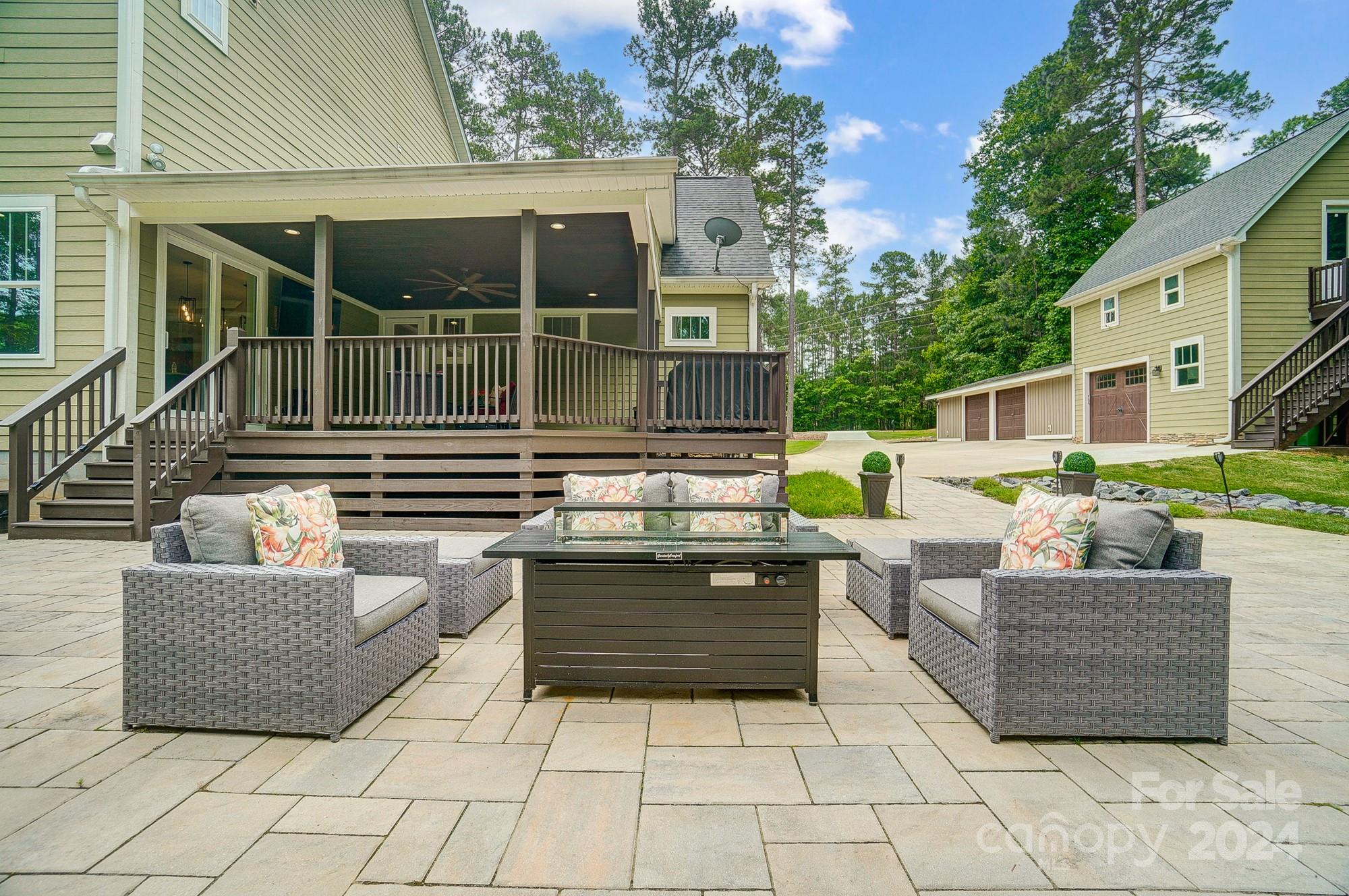 1123 Blacksnake Road Stanley, NC 28164 - Photo 42 of 48 a view of a patio with couches and potted plants