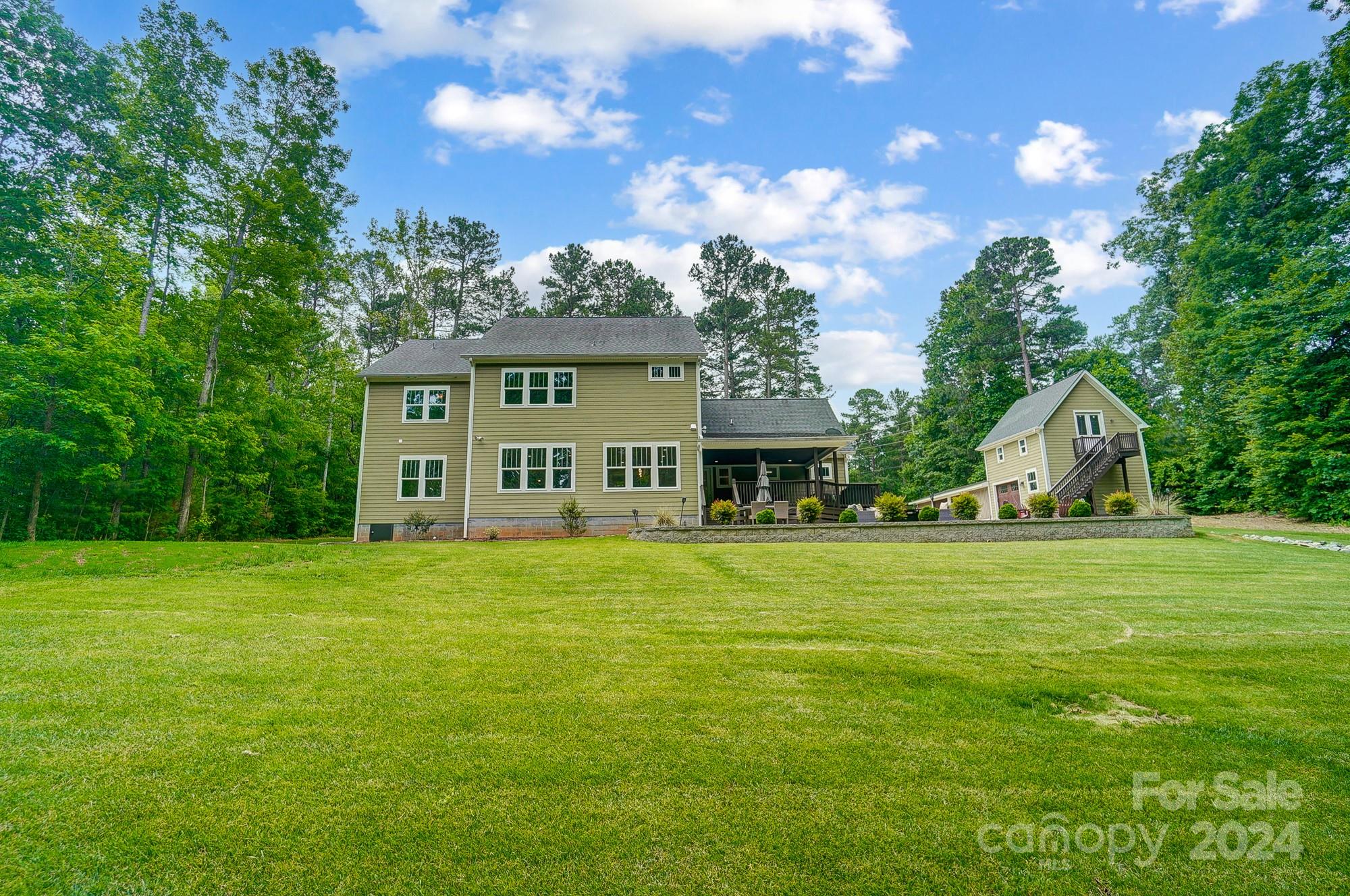 1123 Blacksnake Road Stanley, NC 28164 - Photo 44 of 48 a front view of a house with a garden