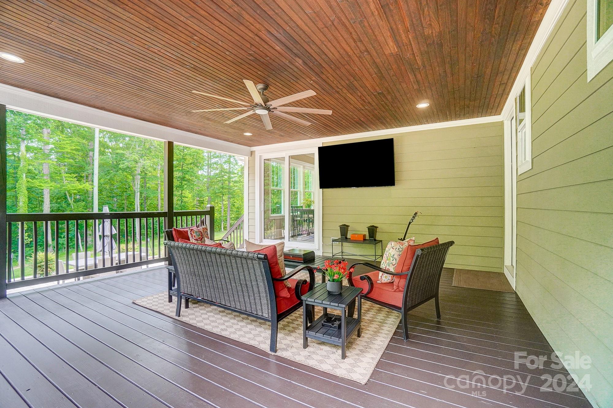 1123 Blacksnake Road Stanley, NC 28164 - Photo 48 of 48 a living room with patio furniture and a flat screen tv