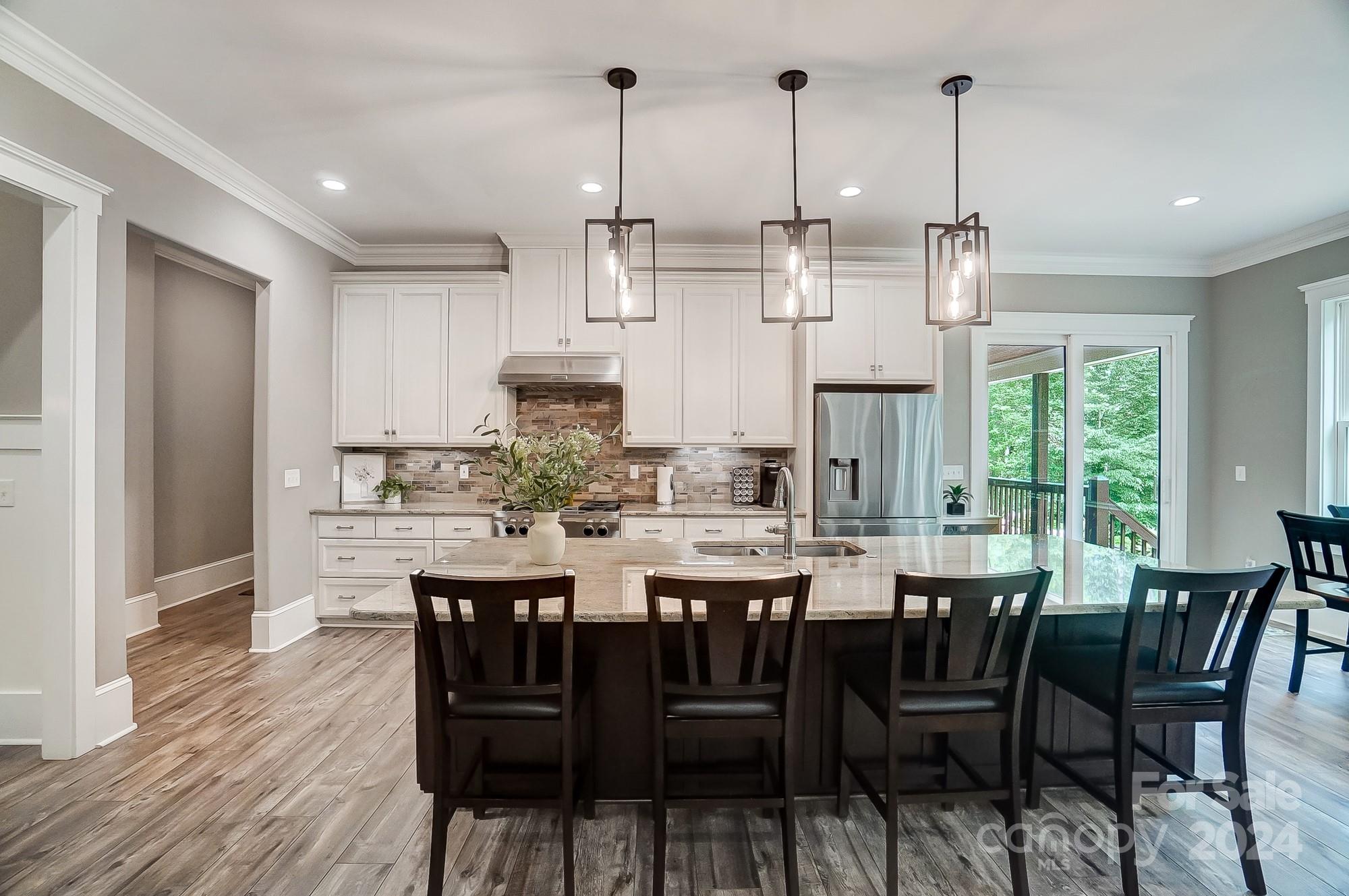 1123 Blacksnake Road Stanley, NC 28164 - Photo 10 of 48 a view of a dining room with furniture window and wooden floor