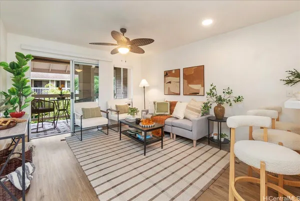 a living room with furniture and a large window