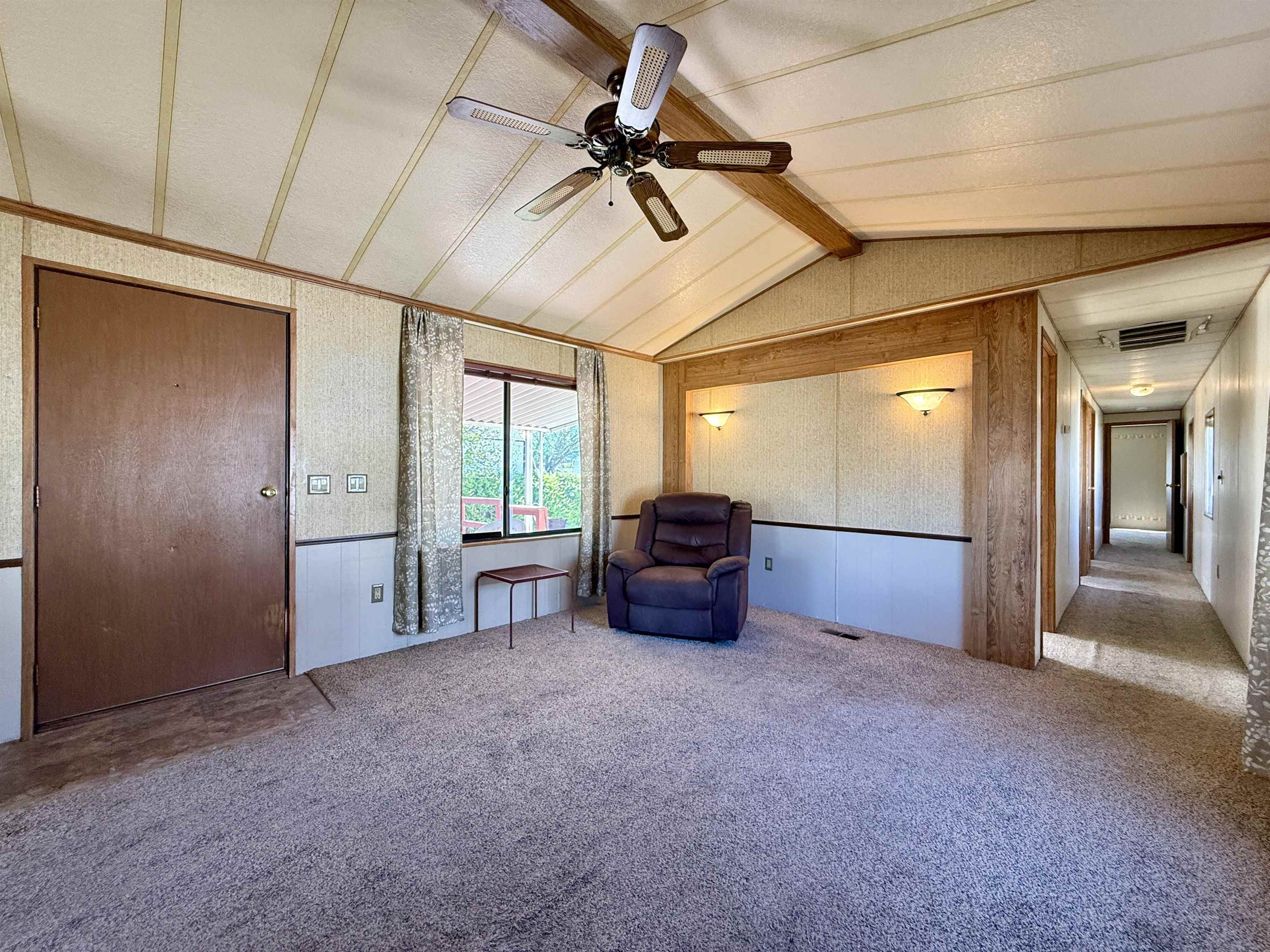 3251 E Road, Unit 33 Clifton, CO 81520 - Photo 14 of 28 a big room with chandelier fan and windows