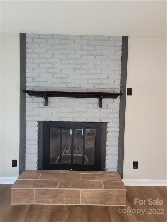 943 Tilden Road Charlotte, NC 28214 - Photo 8 of 14 a view of fireplace and window