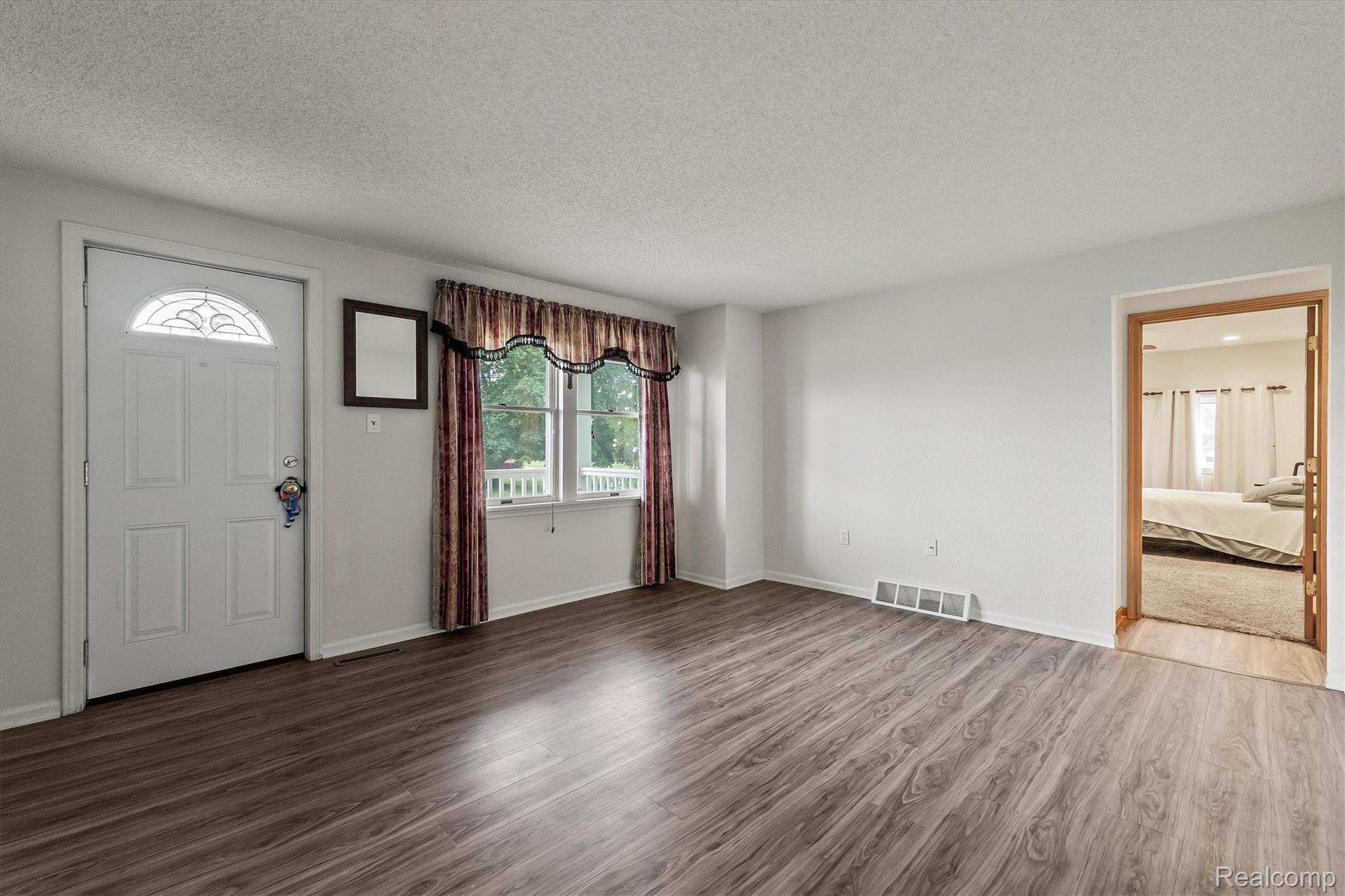 3553 North State Road Owosso, MI 48867 - Photo 6 of 45 Wood-finish flooring throughout the room