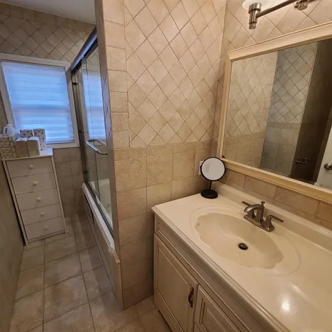 a bathroom with a sink and mirror