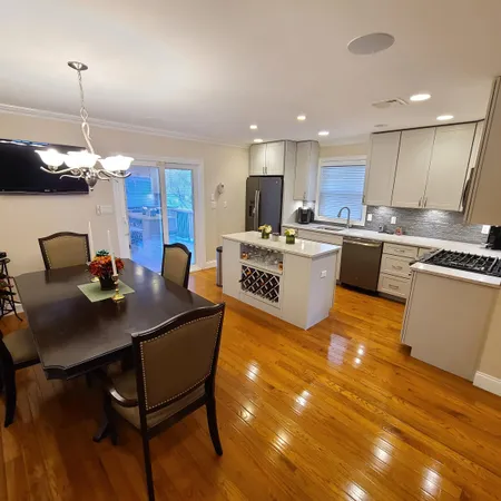 a kitchen with cabinets a sink and appliances