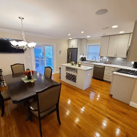 a kitchen with cabinets a sink and appliances