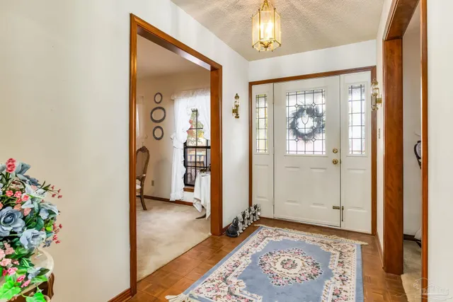 a bedroom with a bed and a mirror