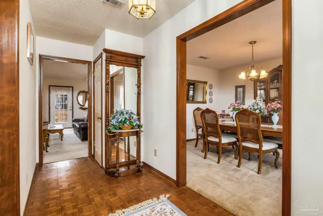 a view of a bedroom with furniture and entryway