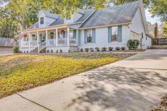 a front view of a house with swimming pool