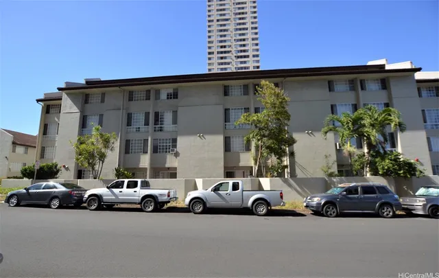 a view of a cars parked in front of a house