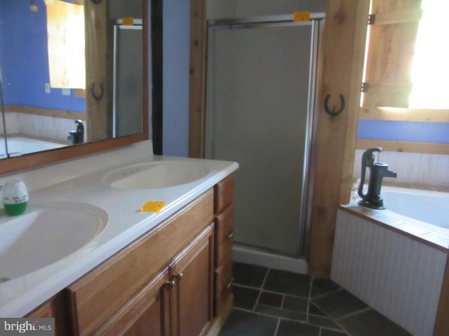 6203 Fooks Mill Road Rhodesdale, MD 21659 - Photo 4 of 11 a bathroom with a sink and a mirror