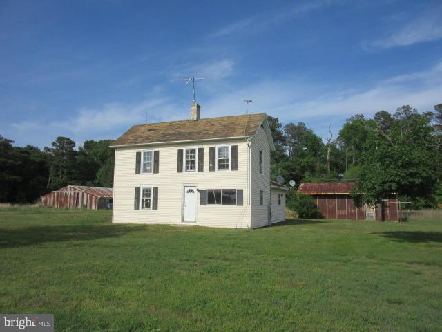 6203 Fooks Mill Road Rhodesdale, MD 21659 - Photo 8 of 11 a front view of a house with a garden