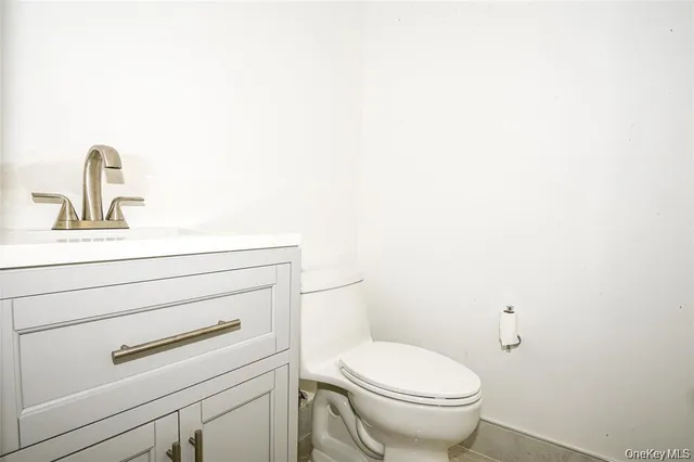 a bathroom with a toilet and a sink