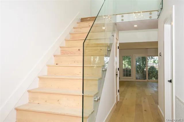a bathroom with a glass shower door