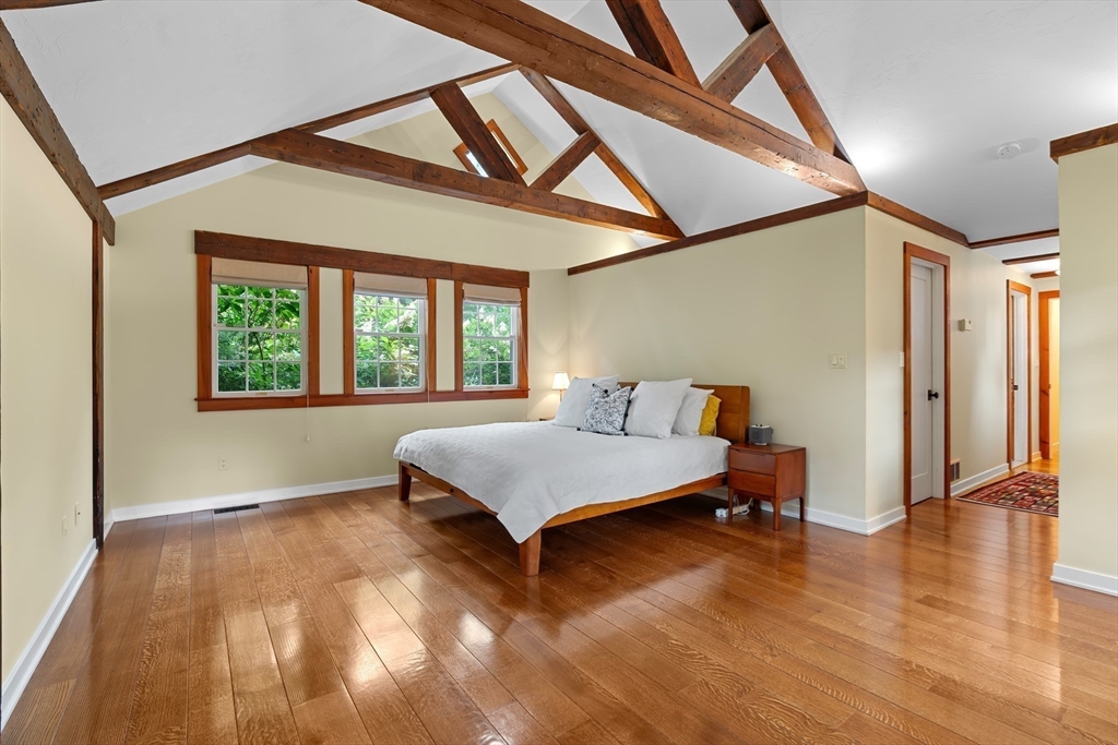 50 3 Ponds Road Wayland, MA 01778 - Photo 18 of 32 a living room with a bed furniture and a window