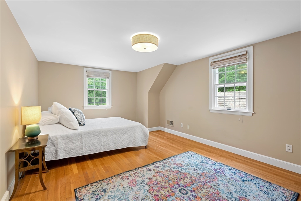 50 3 Ponds Road Wayland, MA 01778 - Photo 24 of 32 a bedroom with natural light and wooden floor