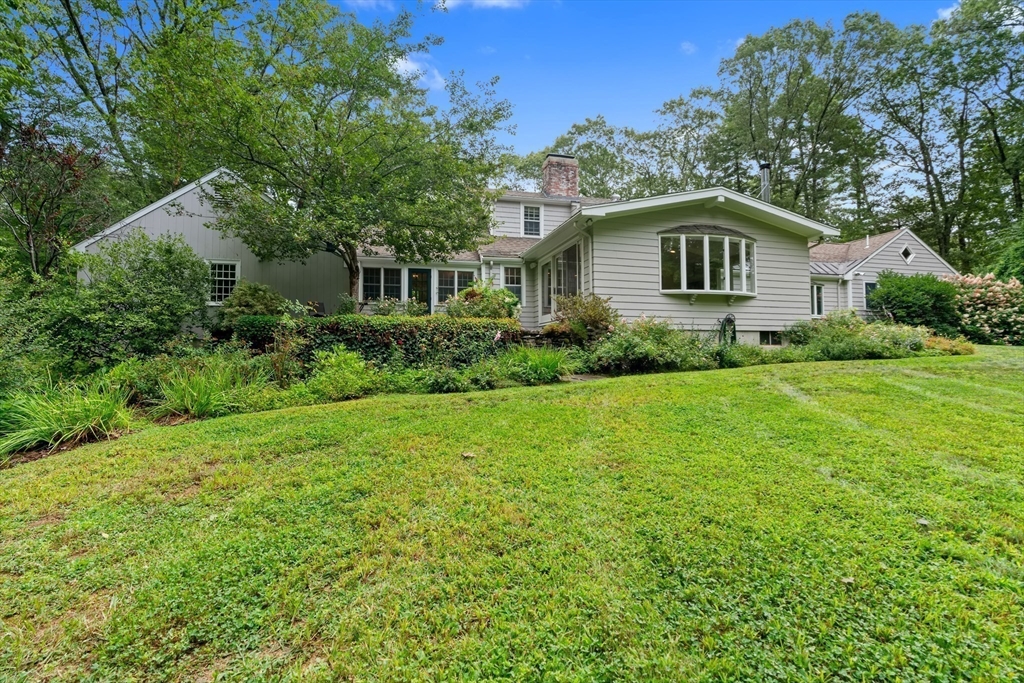 50 3 Ponds Road Wayland, MA 01778 - Photo 29 of 32 a front view of house with yard and green space