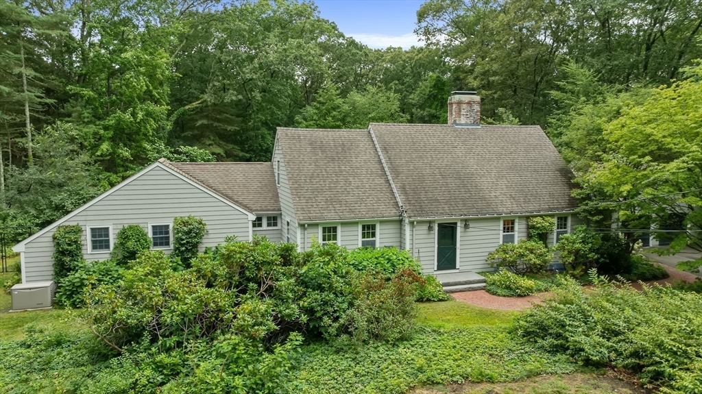 50 3 Ponds Road Wayland, MA 01778 - Photo 3 of 32 a house view with a garden space