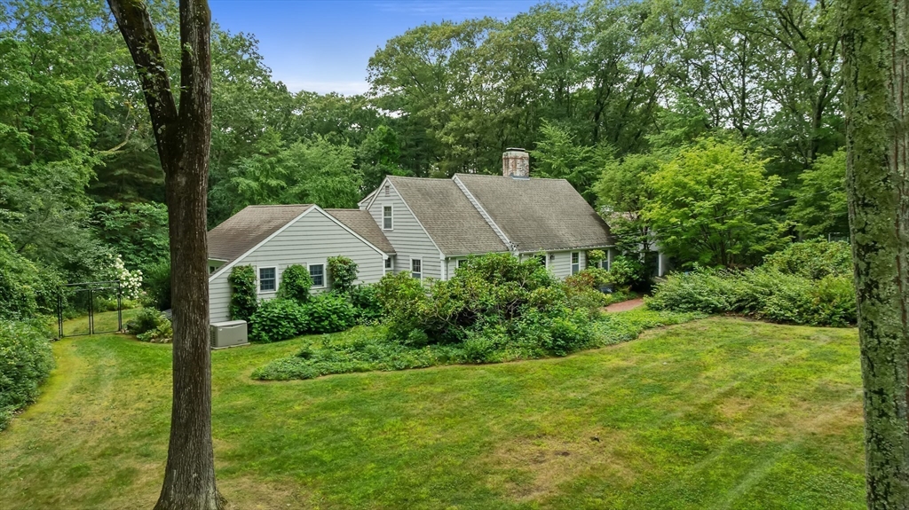 50 3 Ponds Road Wayland, MA 01778 - Photo 31 of 32 a view of a garden with a house
