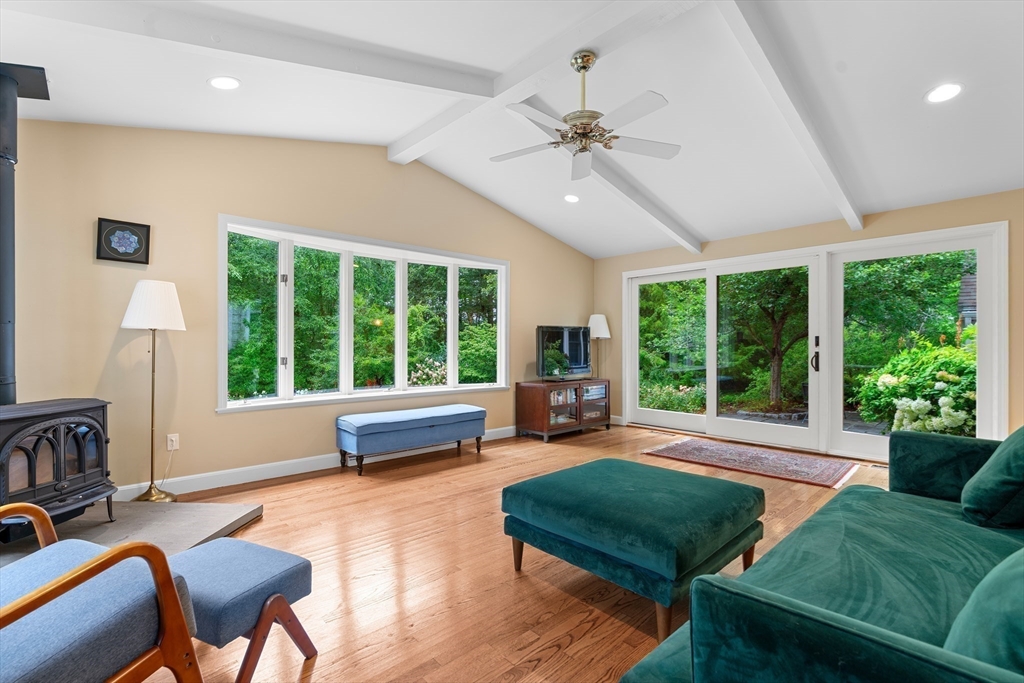 50 3 Ponds Road Wayland, MA 01778 - Photo 8 of 32 a living room with furniture and a large window