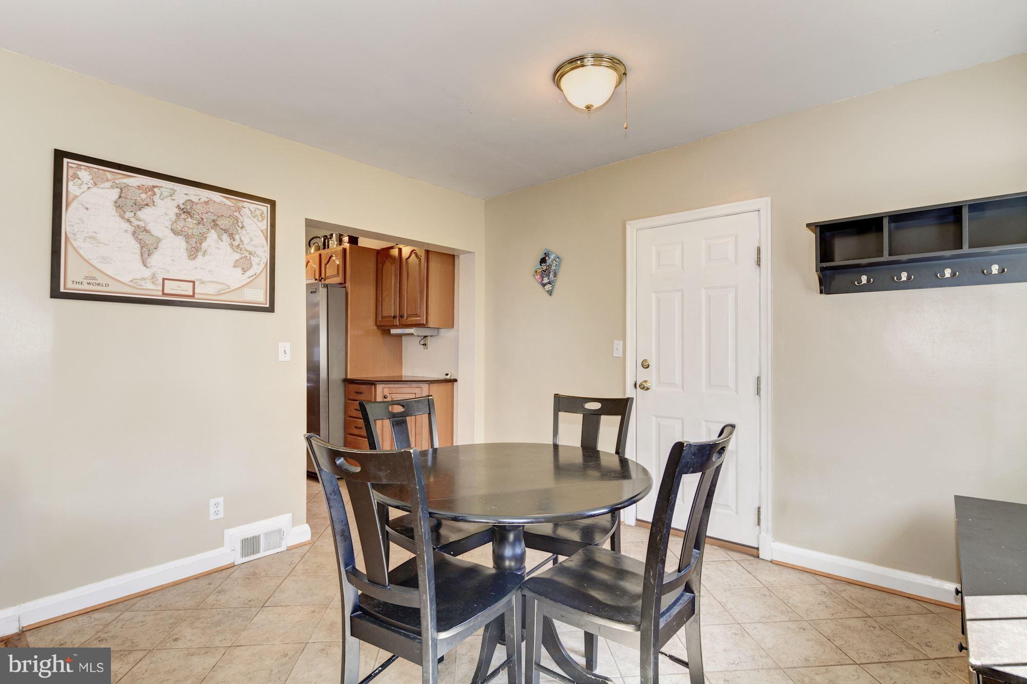 6722 Sherwood Road Baltimore, MD 21239 - Photo 12 of 30 a view of a dining room with furniture