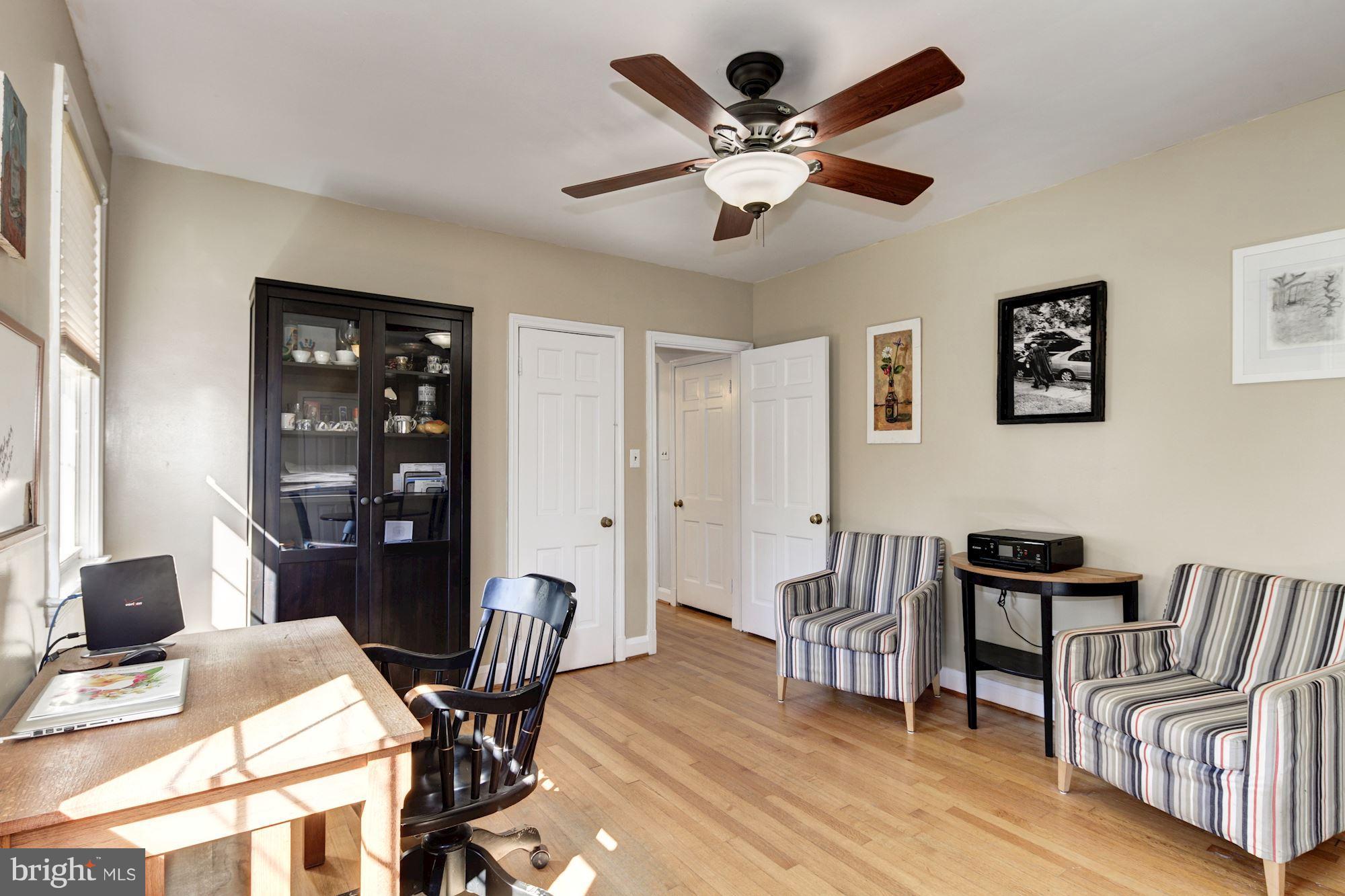 6722 Sherwood Road Baltimore, MD 21239 - Photo 13 of 30 a view of a workspace with furniture and lounge chair
